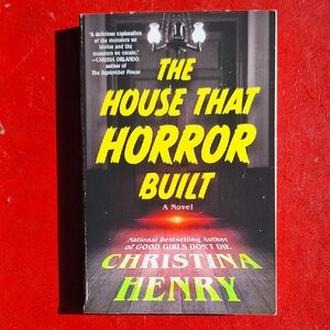 Christina 'The House That Horror Built' Novel - Black and Yellow Cover